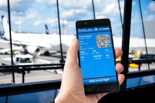 Man Hand Holding Mobile Phone With Mobile Boarding Pass