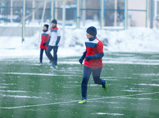 boys play football tournament at the winter stadium