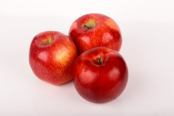 Fototapeta na wymiar Three red apples isolated on white background