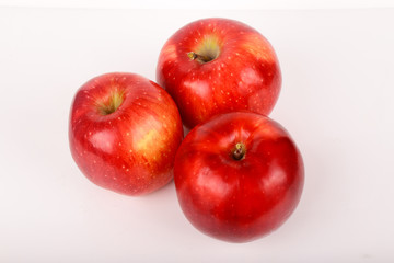 Three red apples isolated on white background