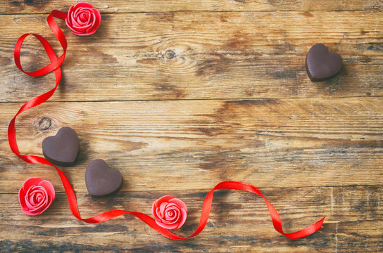 Valentine`s Day greeting card, milk chocolate heart shape, rose