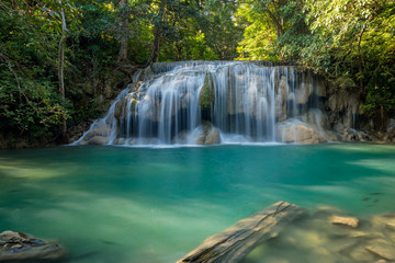 Fototapeta na wymiar Erawan Waterfall with fish in water