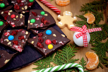 Dark chocolate bark with multicoloured drops, nuts and dried fruits