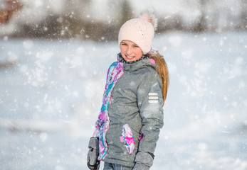 Fototapeta na wymiar Portrait of girl in ski outfit at winter