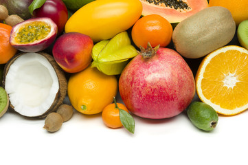 Exotic tropical fruits with slices, healthy food, vegetarian diet, white space for text 