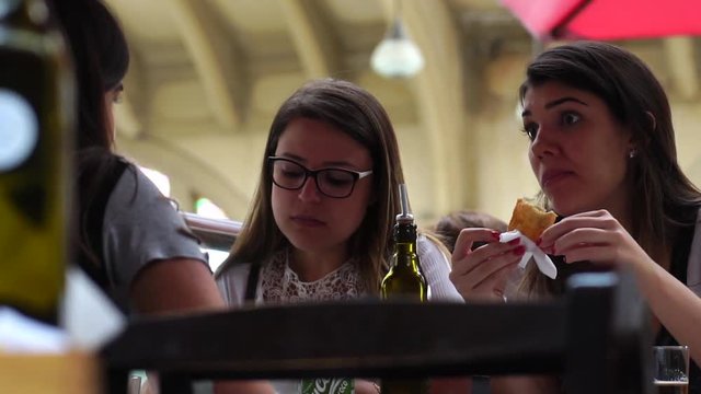 Friends Eating and Taking in a Pub