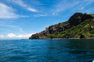 Fototapeta na wymiar Rocky tip of a bay on Sumbawa.