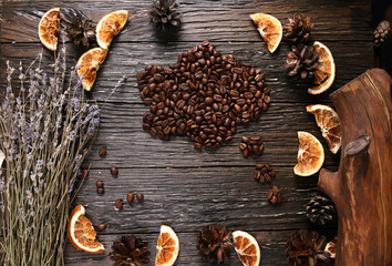 Coffee beans on a wooden board in the form of a cloud