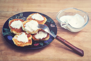 freshly baked cottage cheese pancakes with fresh sour cream