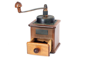Manual coffee grinder on a white background. Antiquary. Retro. Old things. Coffee