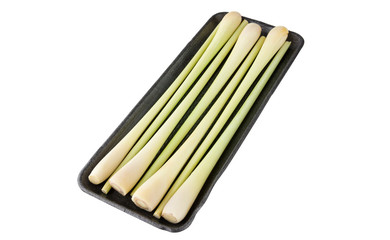 Lemongrass in a plastic container. Fresh stems of lemongrass isolated on white background.
