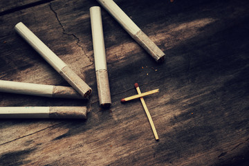 Сigarettes and crucifixion made from matches
