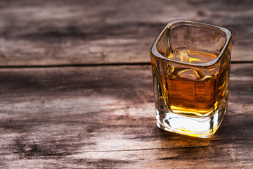 Tequila shot on a wooden background