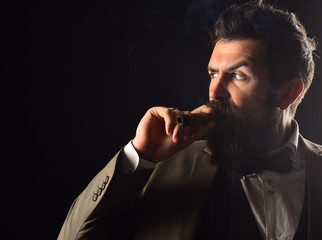 Guy in classic suit has five minute break for smoke.