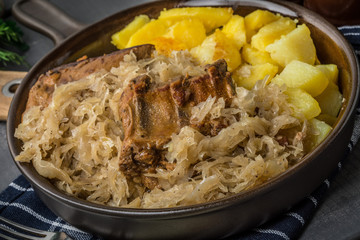 Fried ribs in sauerkraut.