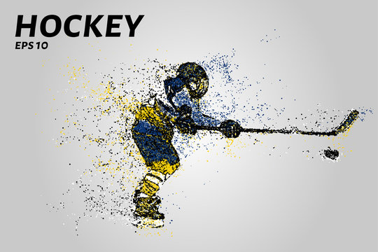 Hockey player in yellow and blue uniform. Hockey from the particles.