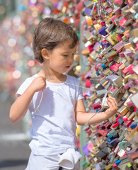 little girl looking at the locks from de Koln Bridge, Germany