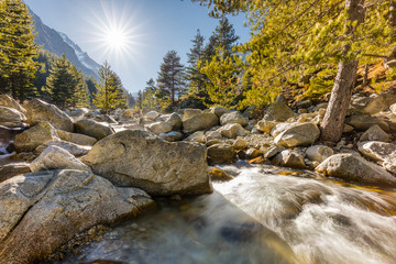 Waterfalls and boulders at Restonica in the mountains of Corsica