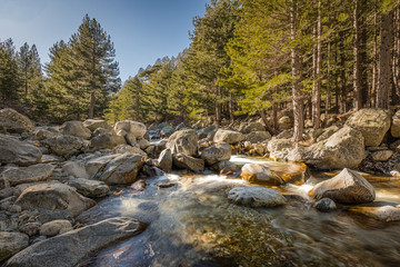 Waterfalls and boulders at Restonica in the mountains of Corsica