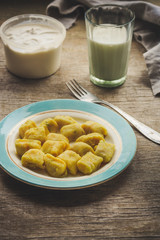 gnocchi in a plate on a wooden table