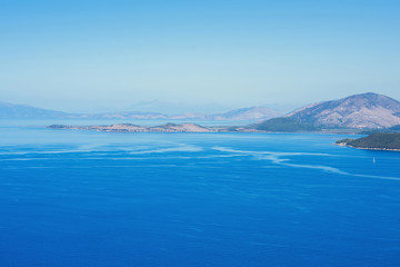 landscape of the Greek island of Kefalonia against the blue sky.