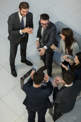 Positive colleagues giving high five