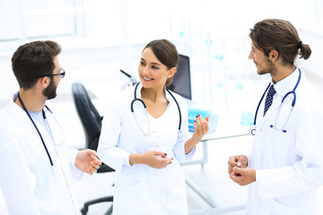 Fototapeta premium Team of different doctors having conversation