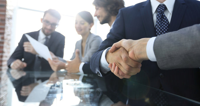 handshake of business partners in conference room