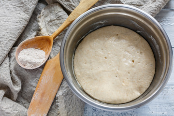 Leaven for the dough in a metal bowl.