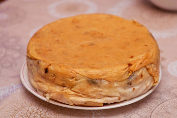 Shah Pilaf with fire on a table in restaurant . Shah pilaf. Khan pilaf in a pita. Pilaff . Pilau . Pilaw . Traditional oriental dish . on tableware . Azerbaijan , Baku .