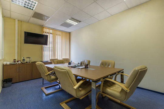 Interior of a modern office meeting room with coffеe mashine