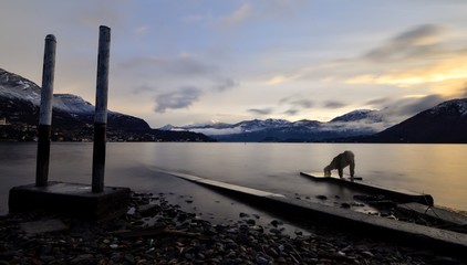 standing up at 7 am to workout on the shore of the como lake 