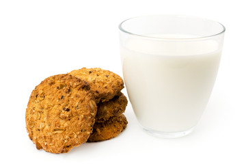 Oatmeal cookies and a glass of milk on a white background.