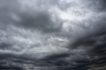Fototapeta premium Dramatic overcast cloudy sky. Thunderclouds flying over horizon, cloudscape.