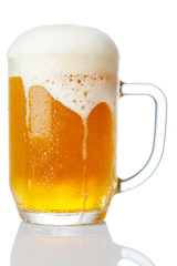 cold mug of beer with foam isolated on white background