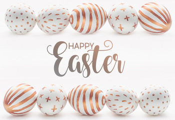 Happy easter postcard banner. Golden Easter eggs on wooden white vintage background.
