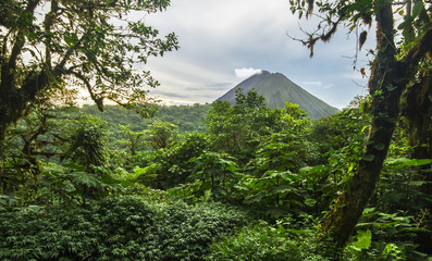 Volcan Arenal rises out of the jungle and dominates the landscape near the town of La Fortuna,...