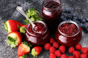 assortment of jams, seasonal berries, mint and fruits