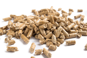 Pile of wood pellets isolated on white background