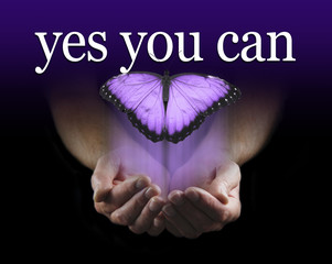 Your Mentor says YES YOU CAN - Male cupped hands emerging from black background with a large purple...