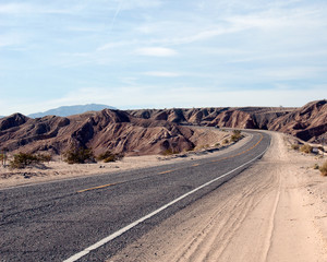 Road Through Desert Cliffs