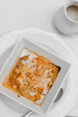 vegan gluten-free apples with almonds under a crumb of the oven, vanilla sauce with coconut milk