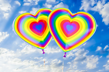 Fototapeta na wymiar Balloons with rainbow LGBT flag in the shape of heart, 3D rendering