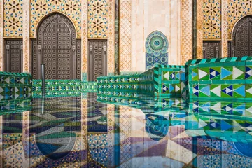 Zelfklevend Fotobehang view of Hassan II mosque's big gate reflected on fountain water - Casablanca - Morocco © Morocko