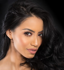 Fototapeta premium Beautiful woman's face and long dark hair