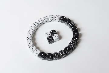 Black and White Dice in Circle Pattern on White Background