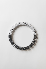 Black and White Dice in Circle Pattern on White Background