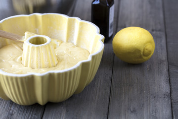 Preparing batter for a lemon cake in a bundt pan
