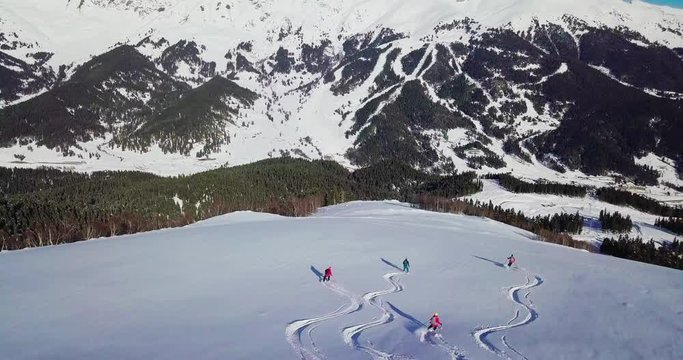 Men are skiing in high mountains