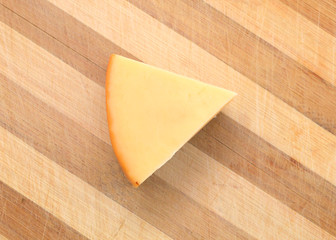 Cheese isolated on wooden board